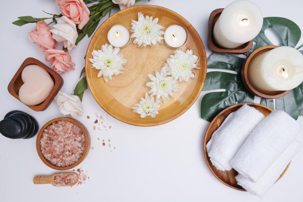 spa concept beauty and fashion concept with spa set perfumed flowers water relaxation and zen spa setting flat lay with bowl bath salt and flowers towel and natural soap top view